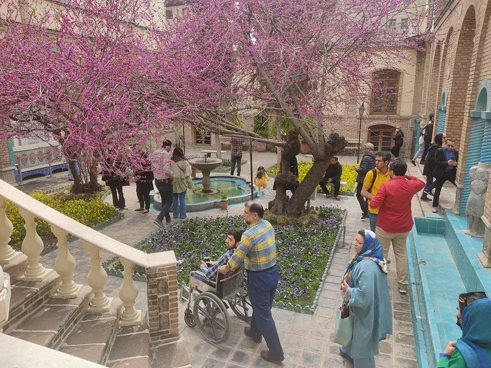 Visitors touring the Moghadam House in Tehran.