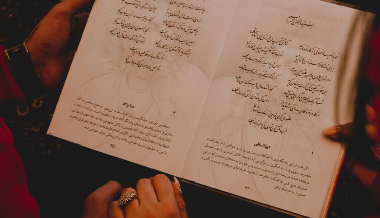 Iranian couple reading a poem from Divan-e Hafez
